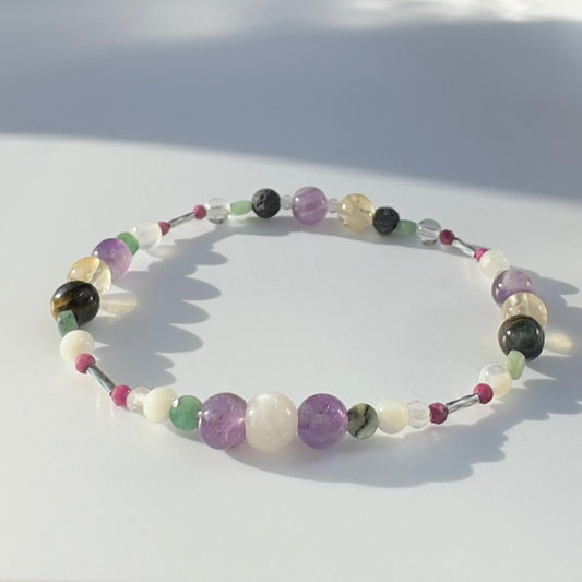 Beaded bracelet in shades of purple yellow and white