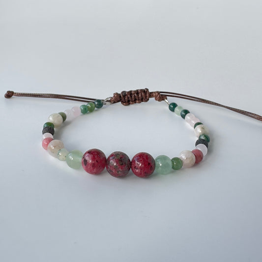Beaded bracelet with multicolored beads on a white background