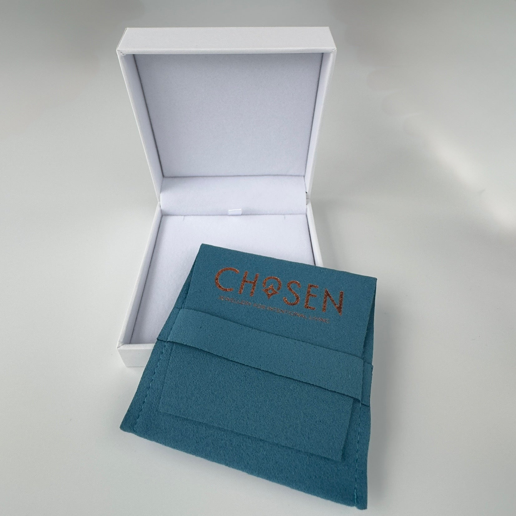 Teal envelope with ‘Chosen' text in a white box on a light gray background
