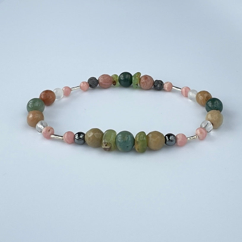 Beaded bracelet in tones of brown green and pink